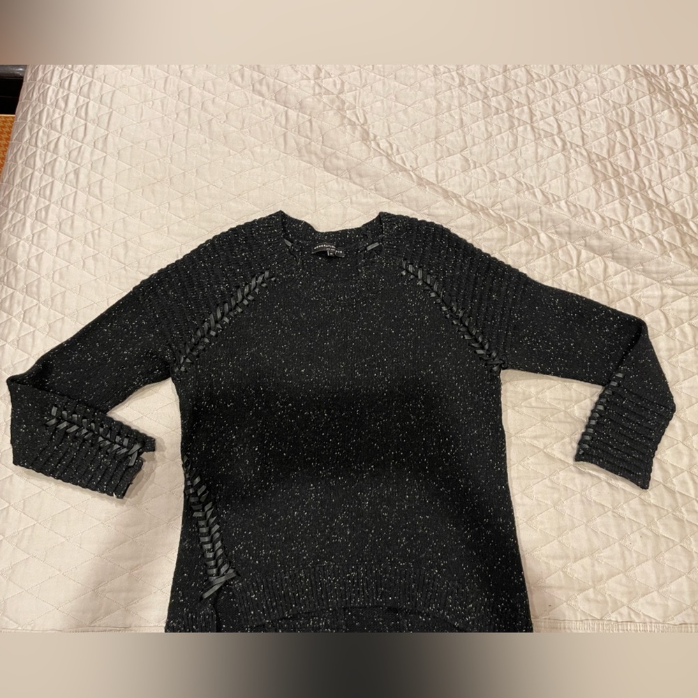 Generation Love sweater with leather cross stitching on shoulders and arms